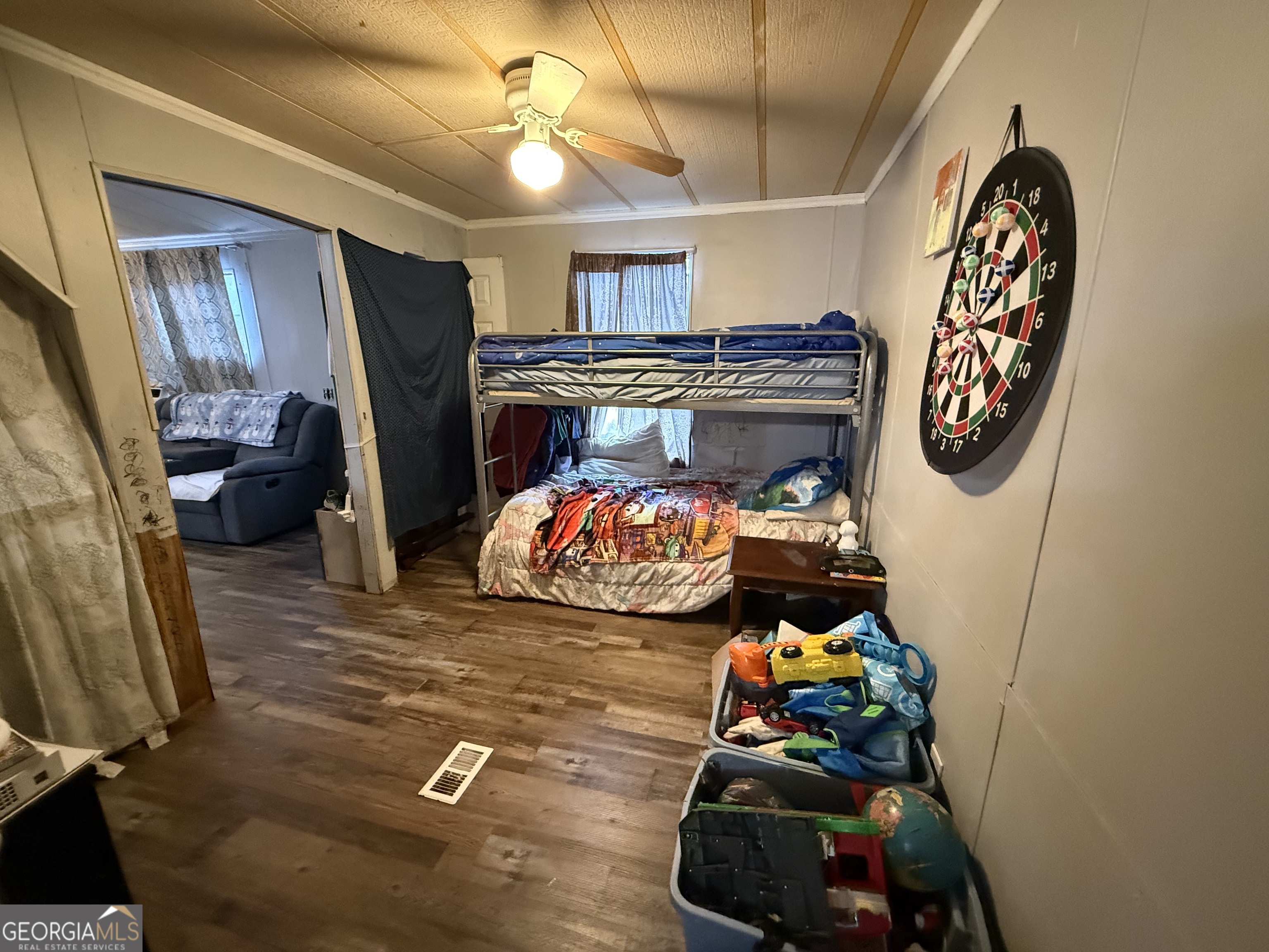 1775-1779 Payne Road Rentz, GA 31075 - Photo 24 of 51 a bedroom with a bed and a chandelier