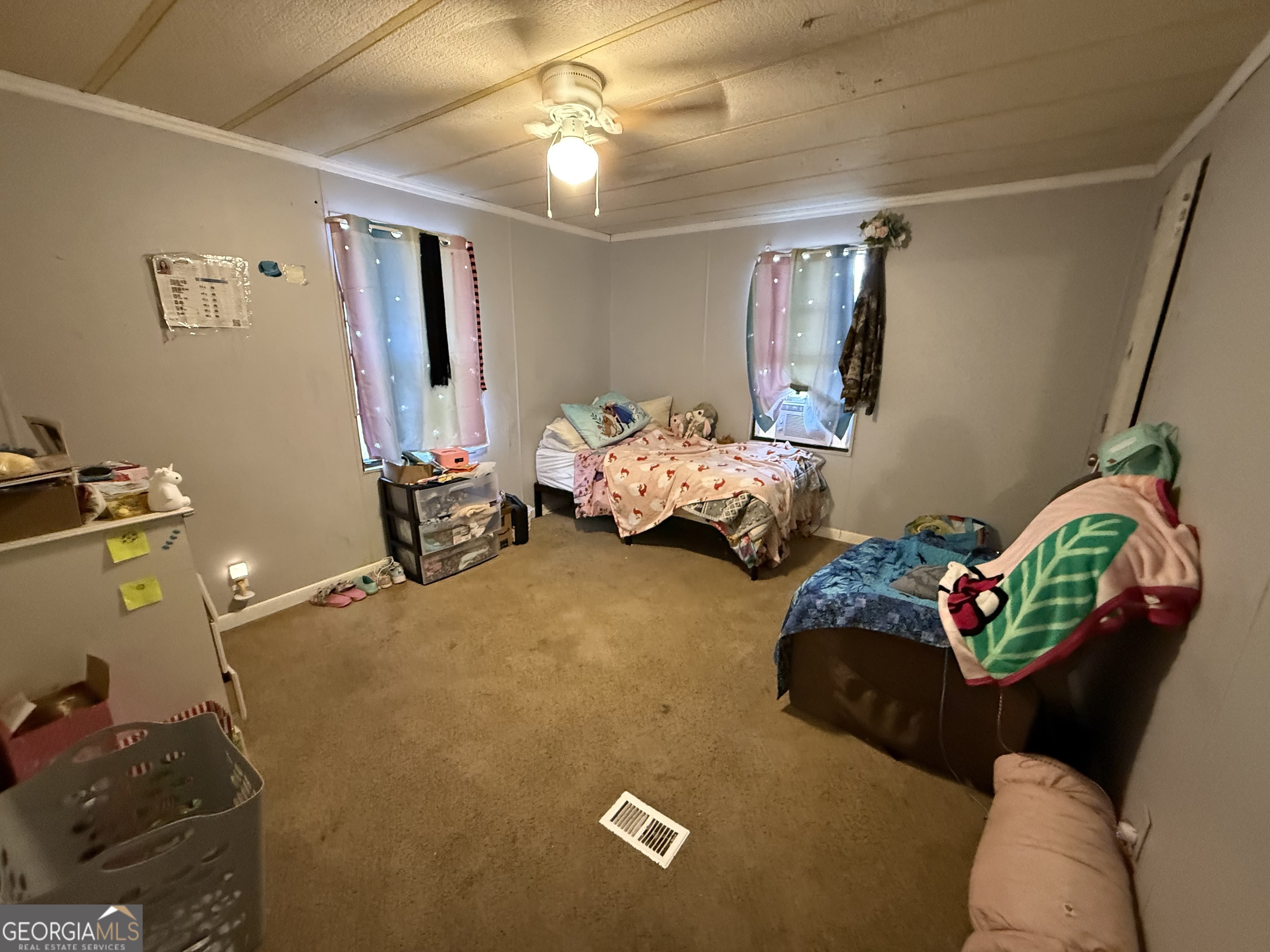1775-1779 Payne Road Rentz, GA 31075 - Photo 27 of 51 a bedroom with bed and window