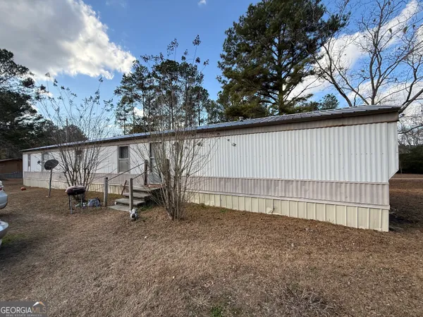 a view of outdoor space with garden and deck