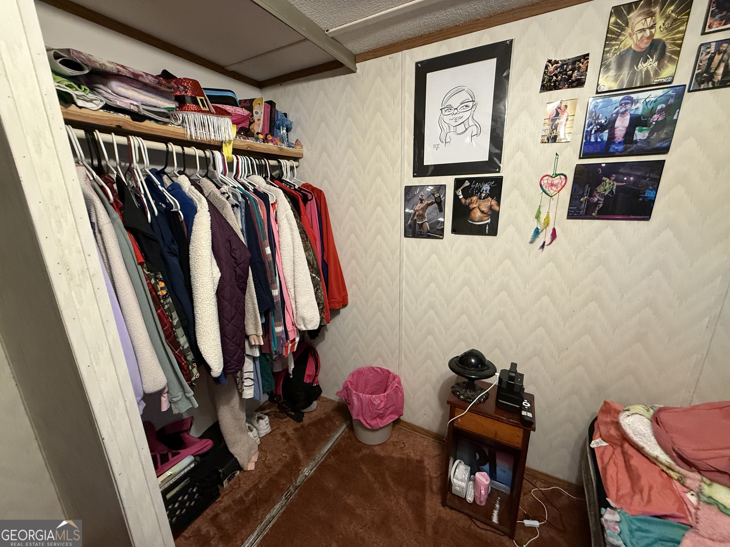 1775-1779 Payne Road Rentz, GA 31075 - Photo 44 of 51 a view of walk in closet with clothes and shoes