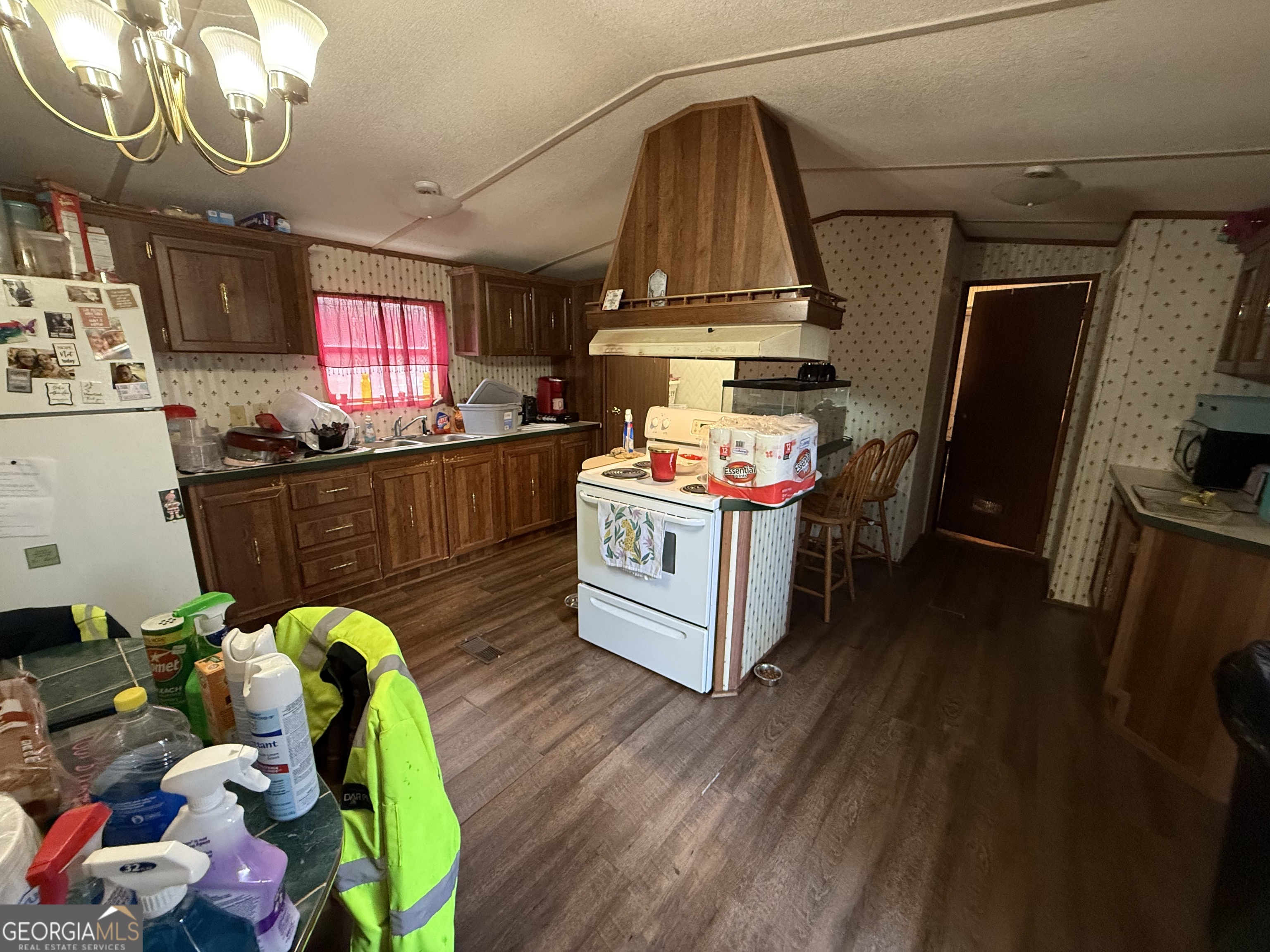 1775-1779 Payne Road Rentz, GA 31075 - Photo 47 of 51 a kitchen with stainless steel appliances a stove a chimney a sink and cabinets