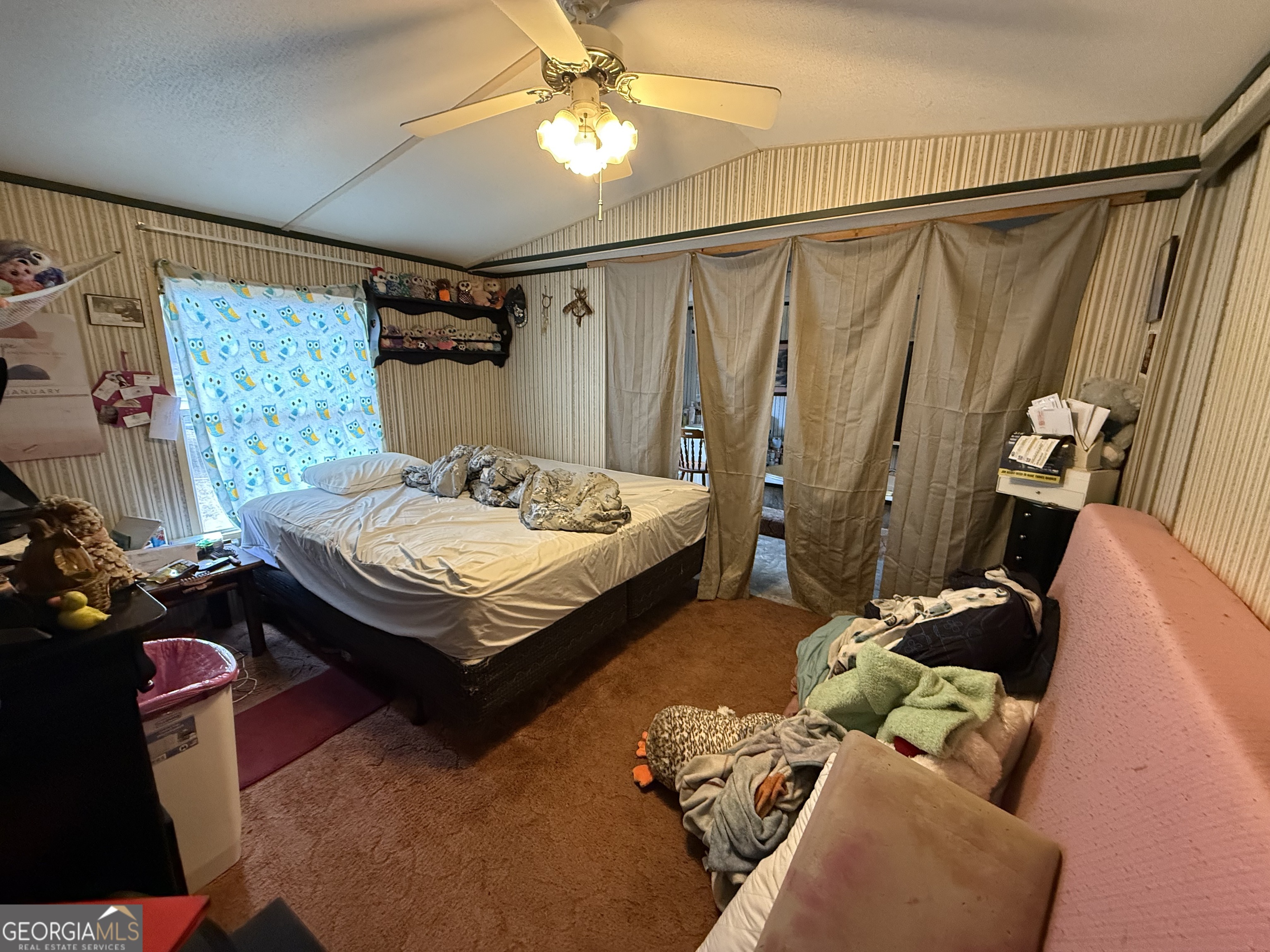 1775-1779 Payne Road Rentz, GA 31075 - Photo 50 of 51 a bedroom with a bed and a chandelier