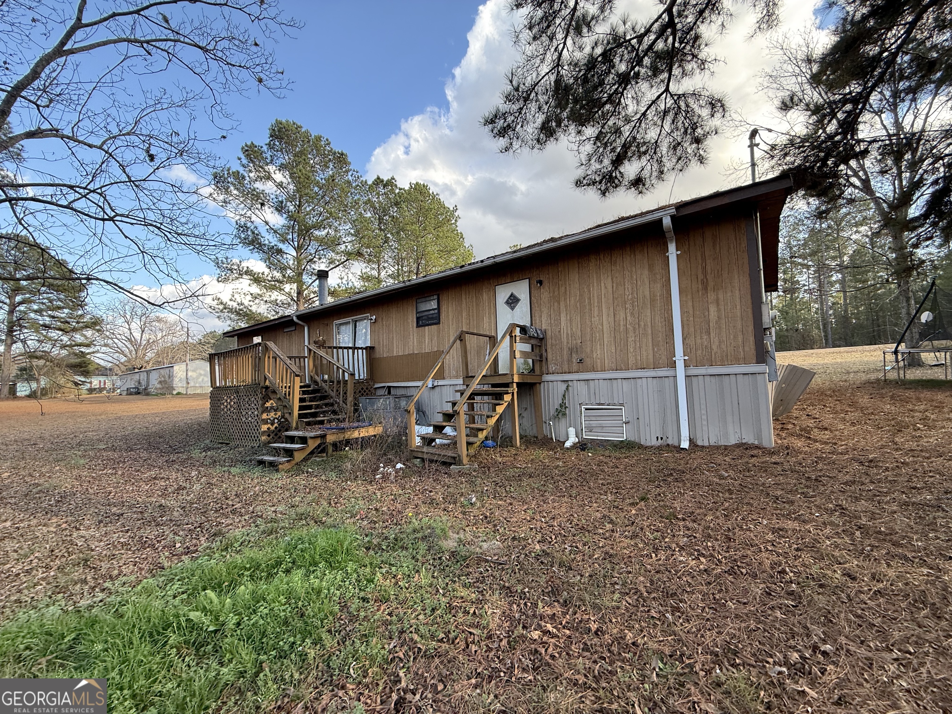 1775-1779 Payne Road Rentz, GA 31075 - Photo 6 of 51 a backyard of a house with table and chairs