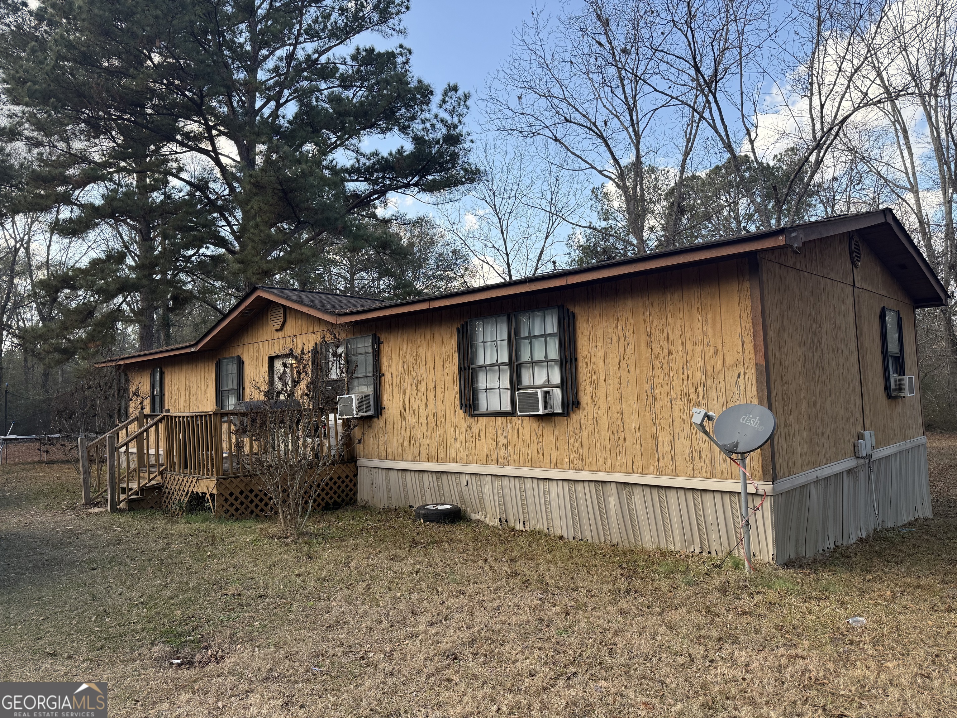 1775-1779 Payne Road Rentz, GA 31075 - Photo 9 of 51 a view of a house with a large tree and wooden fence