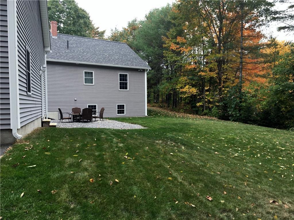 Large backyard with sitting area. ...