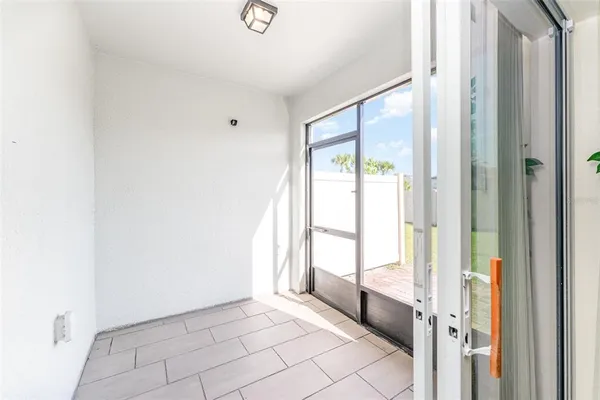 a view of an empty room and window