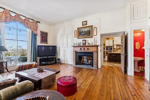 a room with stainless steel appliances kitchen island granite countertop furniture and a kitchen view