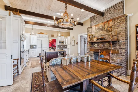 a living room with furniture fireplace and flat screen tv