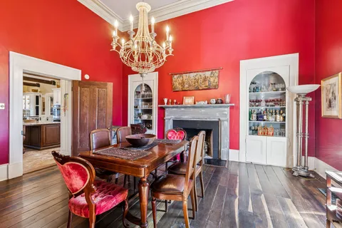 a view of a house with swimming pool and a yard