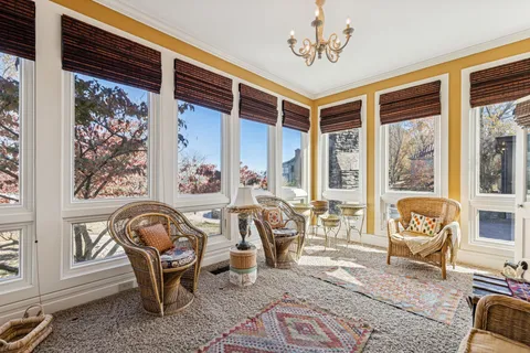 a backyard of a house with lots of green space and garden