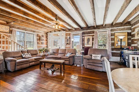 a backyard of a house with a garden and barbeque oven