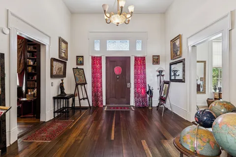 a view of a furniture room with a book shelf
