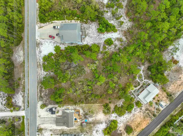 an aerial view of residential house with an outdoor space