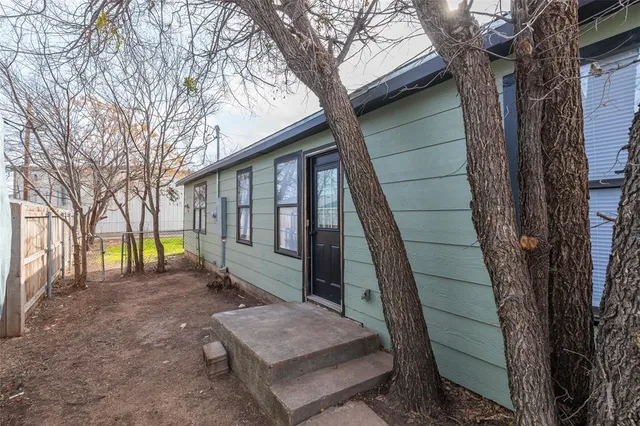 a house view with a backyard space