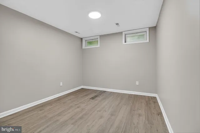 a view of room with wooden floor