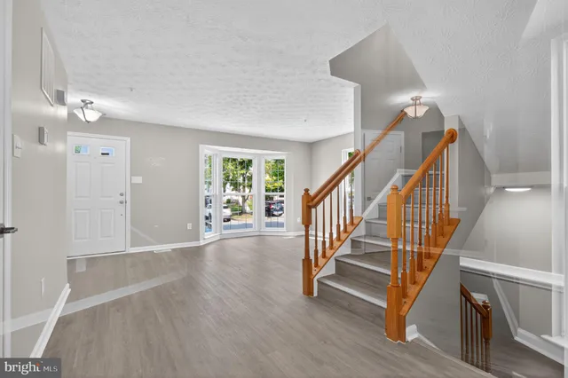 a view of entryway with wooden floor