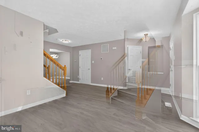 a view of entryway with wooden floor