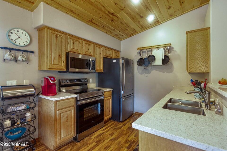 4800 West Tatanka Loop Show Low, AZ 85901 - Photo 11 of 36 a kitchen that has a sink and a stove top oven
