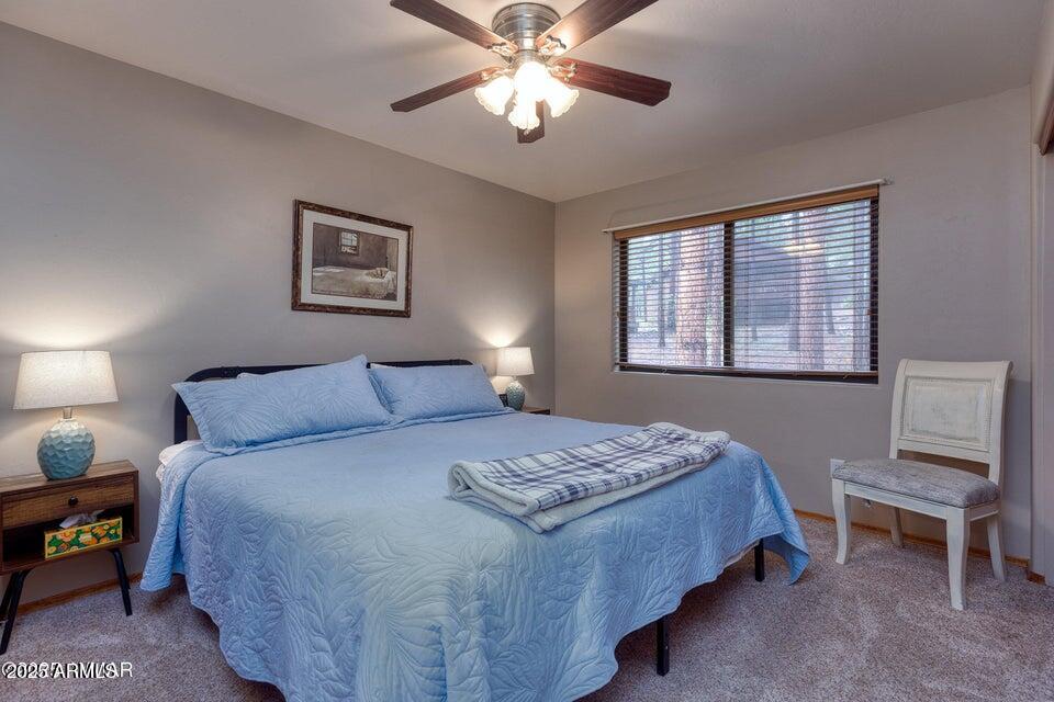 4800 West Tatanka Loop Show Low, AZ 85901 - Photo 15 of 36 a bedroom with a bed and a window