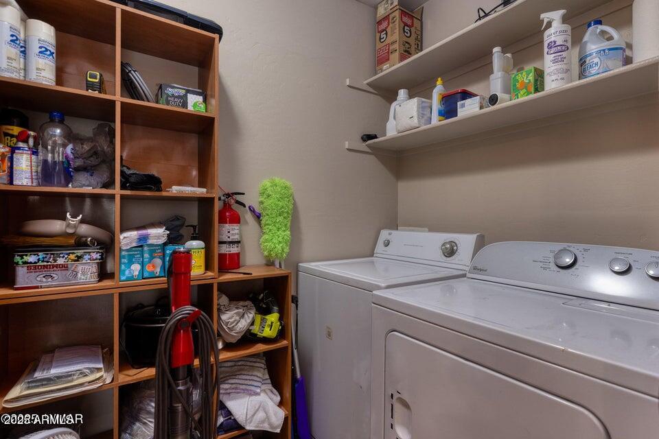 4800 West Tatanka Loop Show Low, AZ 85901 - Photo 20 of 36 a utility room with dryer and washer