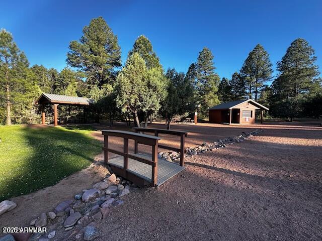 4800 West Tatanka Loop Show Low, AZ 85901 - Photo 35 of 36 a view of a bench in backyard of the house