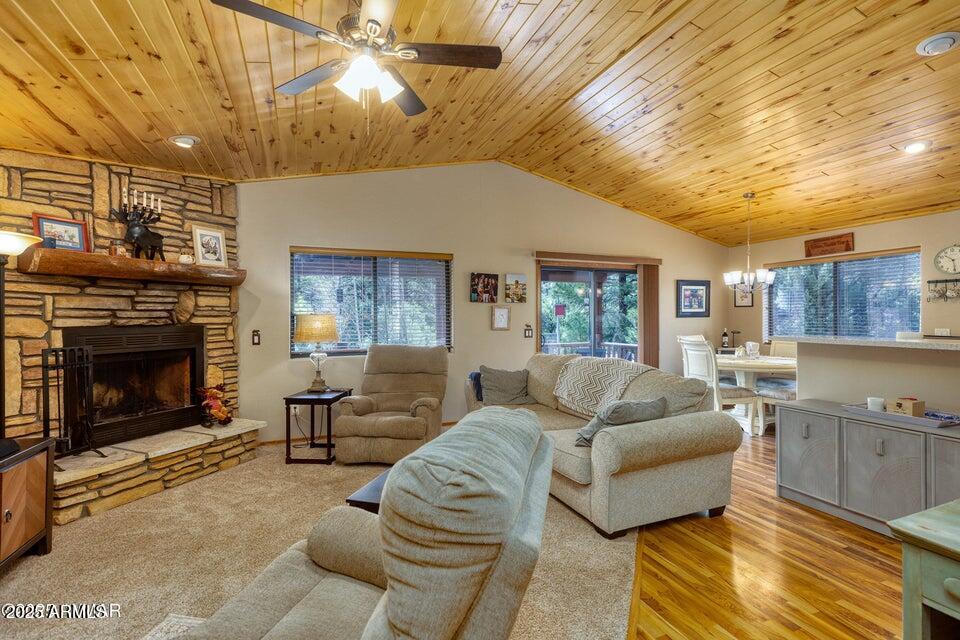 4800 West Tatanka Loop Show Low, AZ 85901 - Photo 5 of 36 a living room with furniture and a fireplace