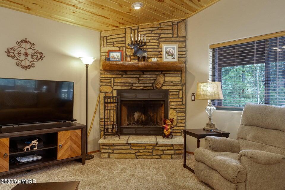 4800 West Tatanka Loop Show Low, AZ 85901 - Photo 7 of 36 a living room with furniture and a flat screen tv