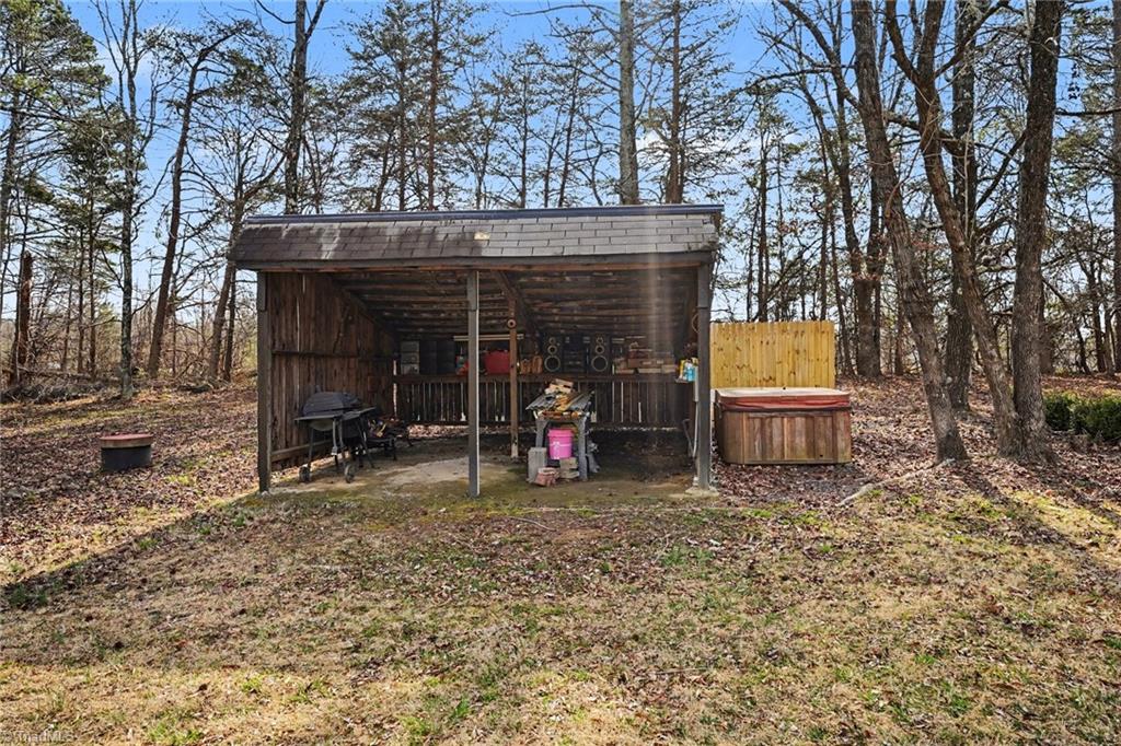 5830 Butler Road Gibsonville, NC 27249 - Photo 29 of 37 Shed and hot tub
