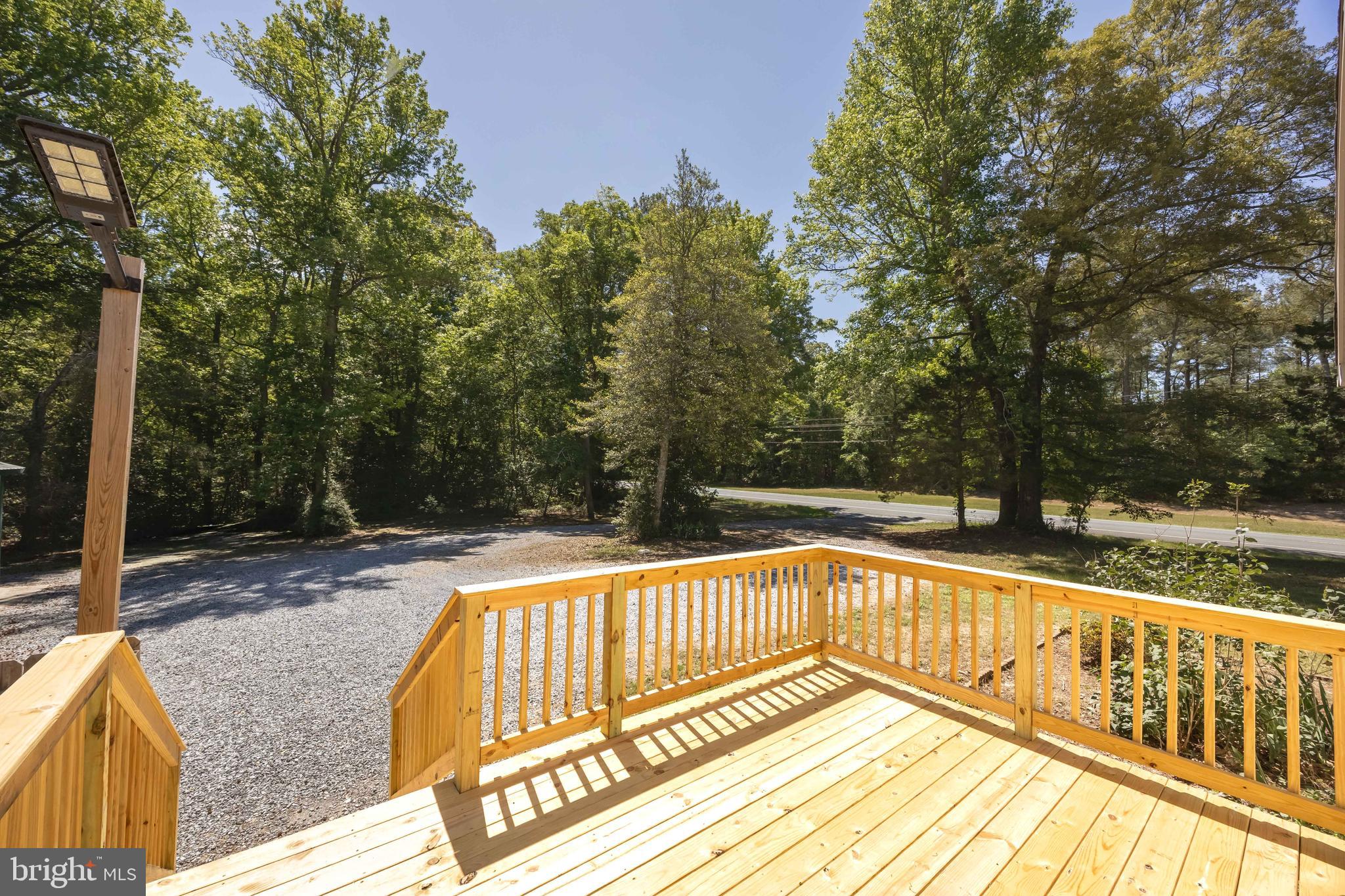 6635 Libertytown Road Berlin, MD 21811 - Photo 69 of 88 a view of balcony with wooden floor and fence