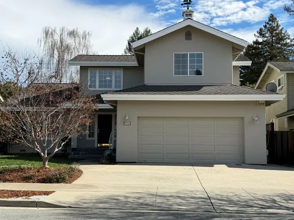 a house with trees in the background