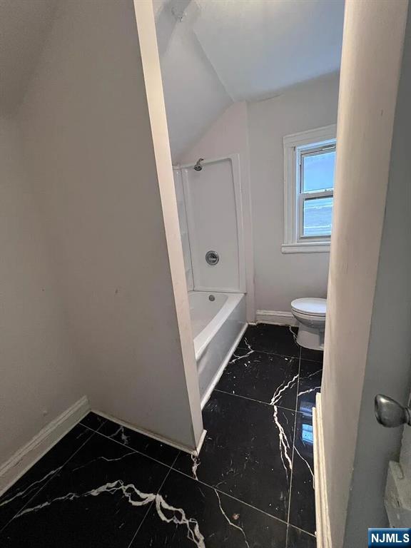 87 Rosa Parks Boulevard Paterson, NJ 07524 - Photo 4 of 6 a bathroom with a sink and a toilet