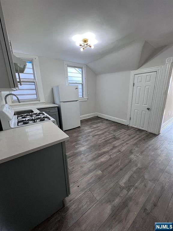 87 Rosa Parks Boulevard Paterson, NJ 07524 - Photo 6 of 6 an empty room with windows and cabinet