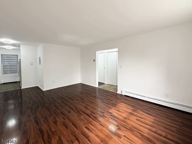 19 Van Rensselear Street, Unit 2 Belleville, NJ 07109 - Photo 2 of 7 a view of empty room with wooden floor