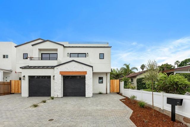 a front view of a house with a garage