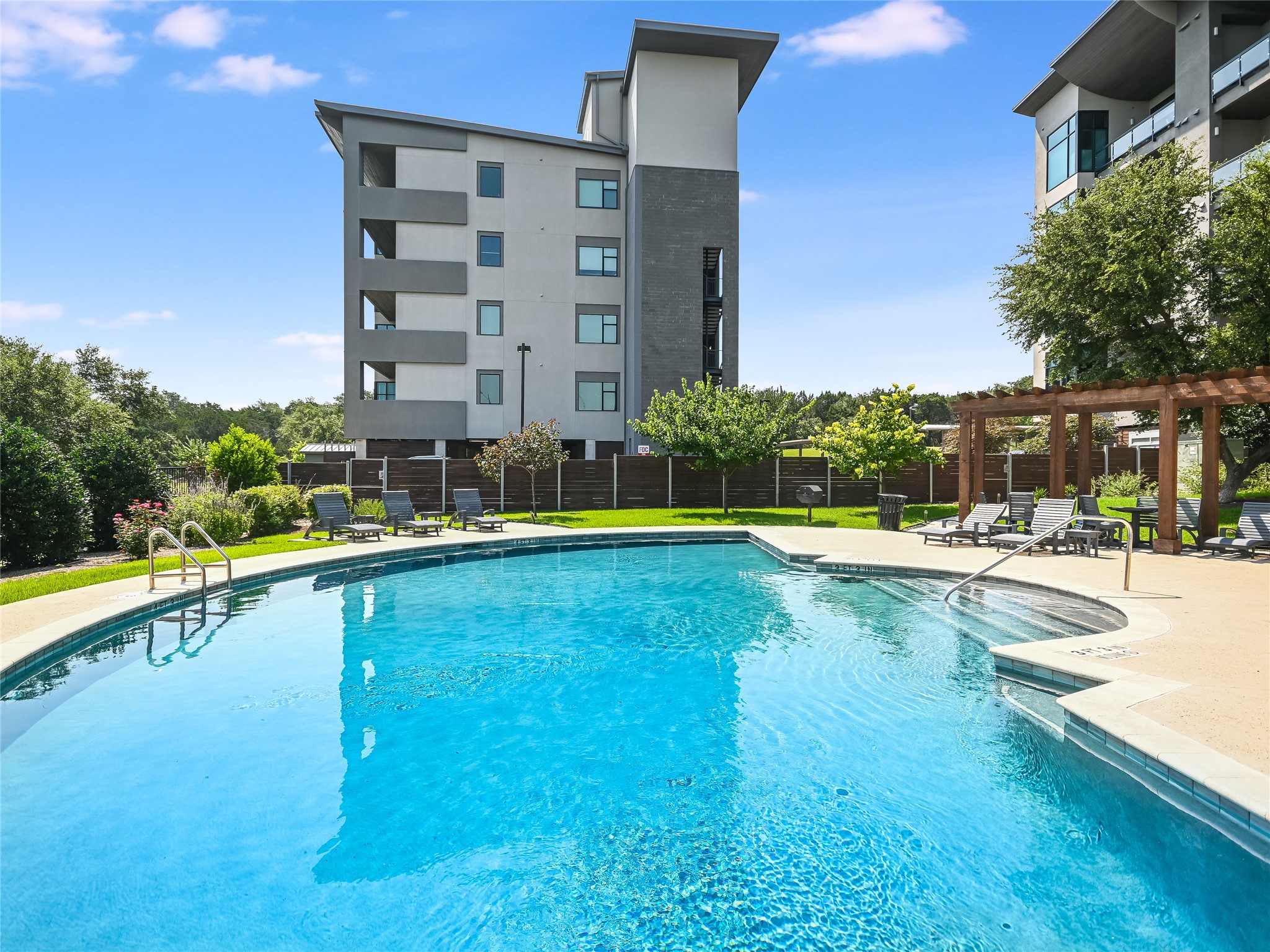 5921 Hiline Road, Unit 2402 Austin, TX 78734 - Photo 20 of 31 Entrance into the pool grounds is secured by access coded gates.