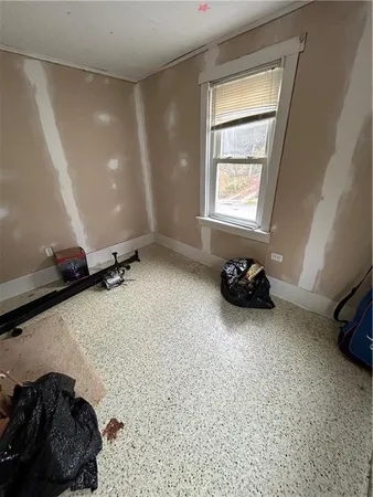 a room with a bed and a window