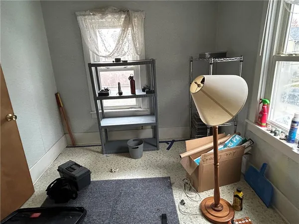 a room with furniture and a mirror