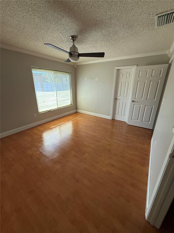 2075 Shadow Pine Drive Brandon, FL 33511 - Photo 26 of 57 an empty room with windows and fan