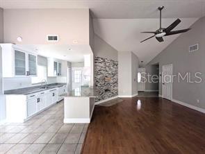 2075 Shadow Pine Drive Brandon, FL 33511 - Photo 10 of 57 a kitchen with granite countertop a stove a sink and a refrigerator
