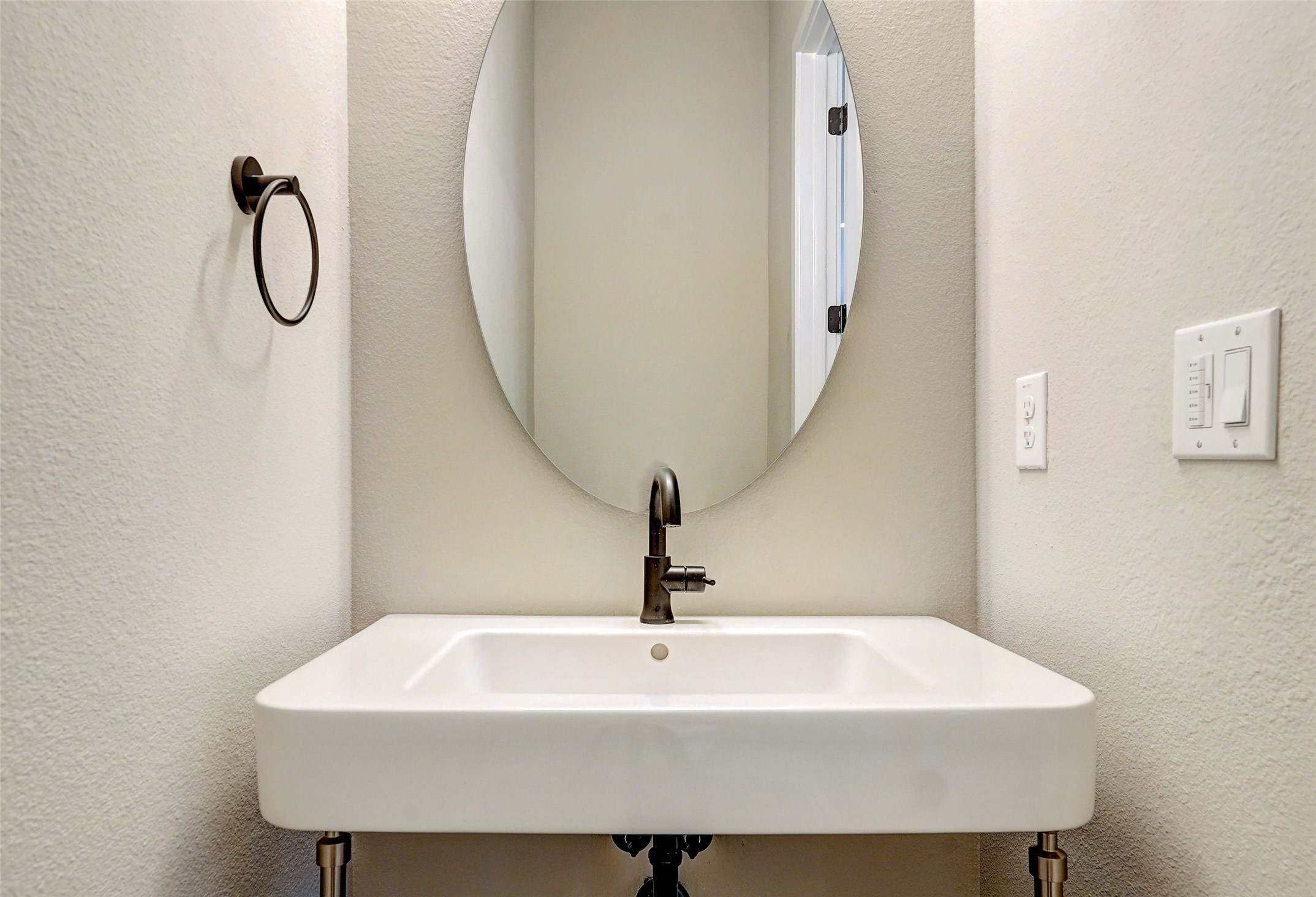 3809 Valley View Road, Unit 13 Austin, TX 78704 - Photo 11 of 27 a white sink sitting under a bathroom mirror