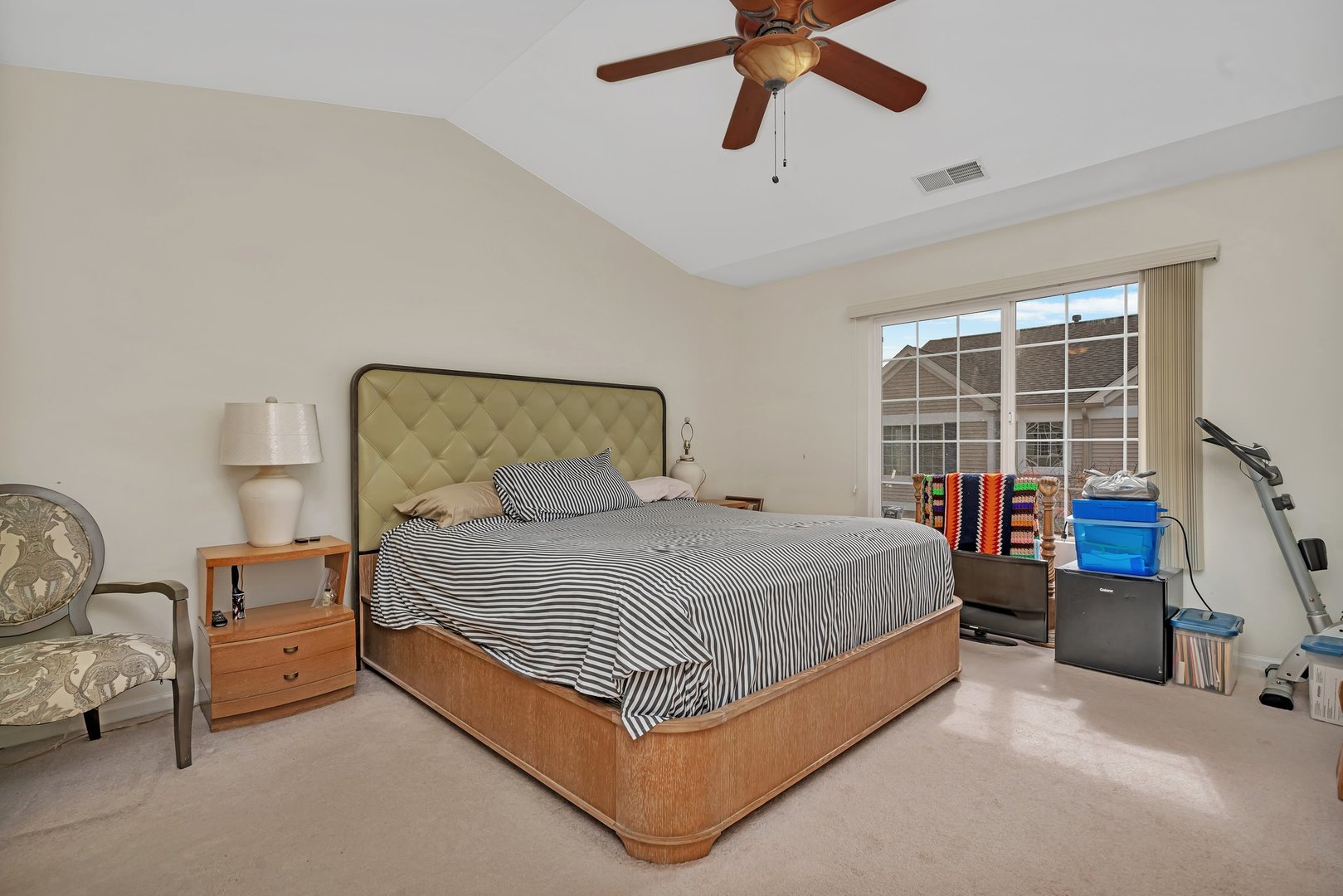 122 Enclave Circle, Unit D Bolingbrook, IL 60440 - Photo 12 of 20 a bed sitting in a bedroom next to a window