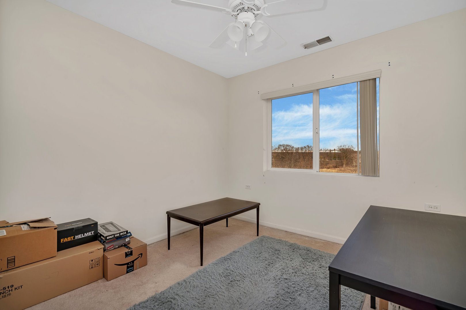 122 Enclave Circle, Unit D Bolingbrook, IL 60440 - Photo 14 of 20 a living room with furniture and a window