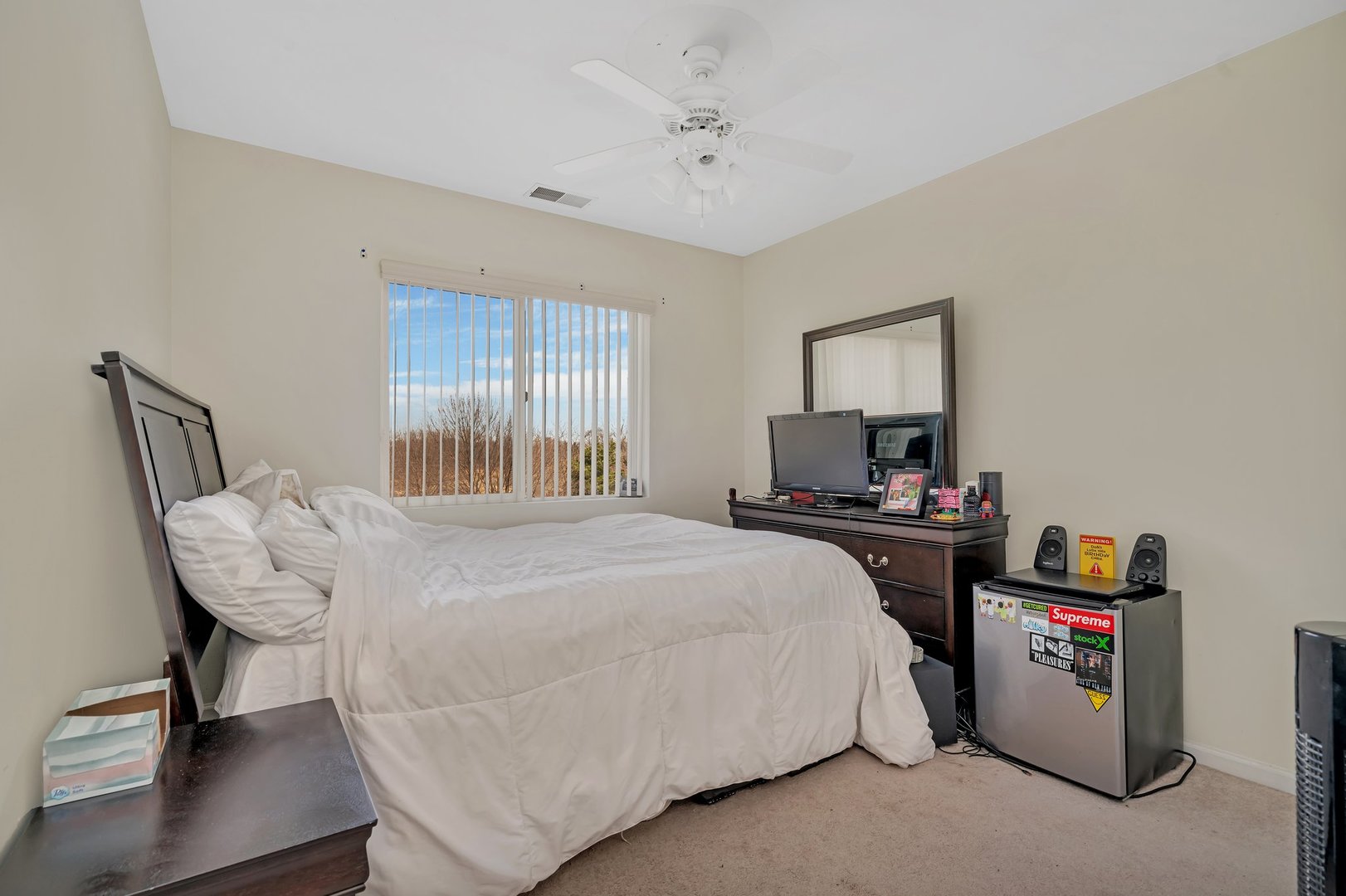 122 Enclave Circle, Unit D Bolingbrook, IL 60440 - Photo 15 of 20 a bedroom with a bed and a chandelier