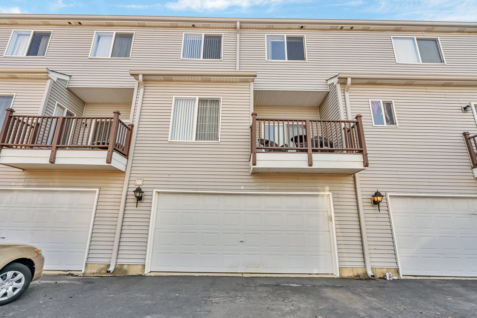122 Enclave Circle, Unit D Bolingbrook, IL 60440 - Photo 20 of 20 a view of a house with a parking space