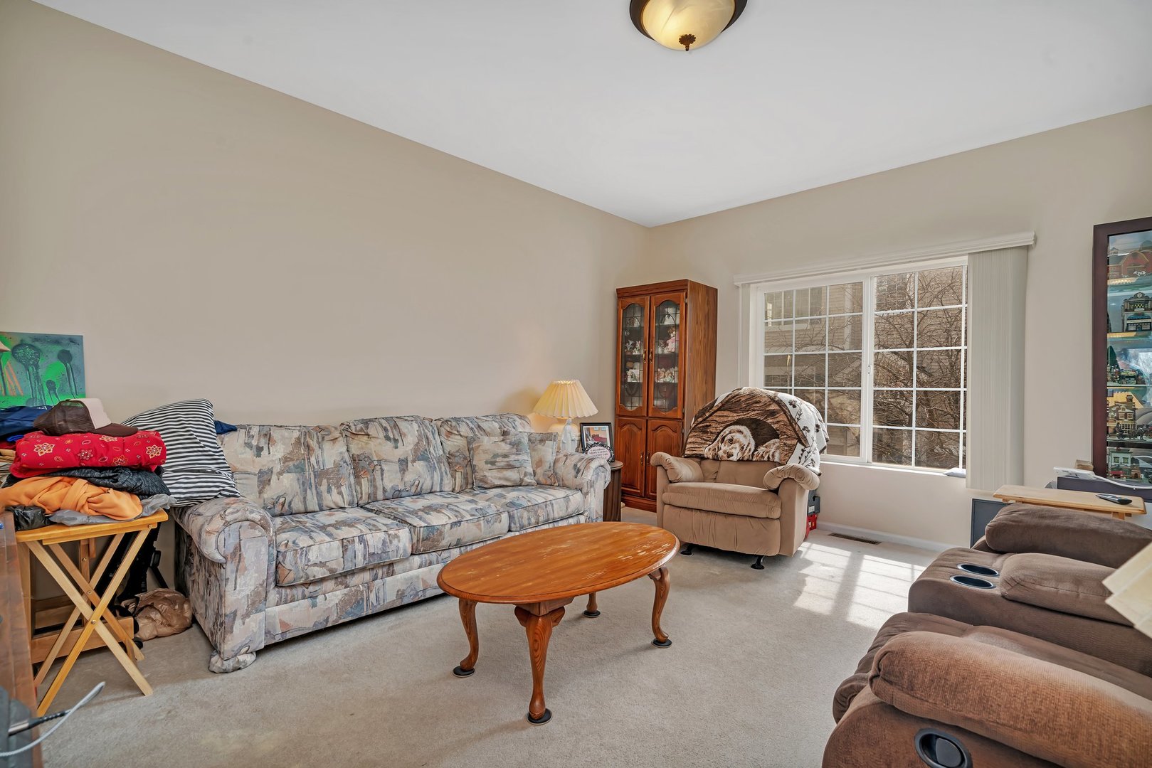 122 Enclave Circle, Unit D Bolingbrook, IL 60440 - Photo 3 of 20 a living room with furniture and a window