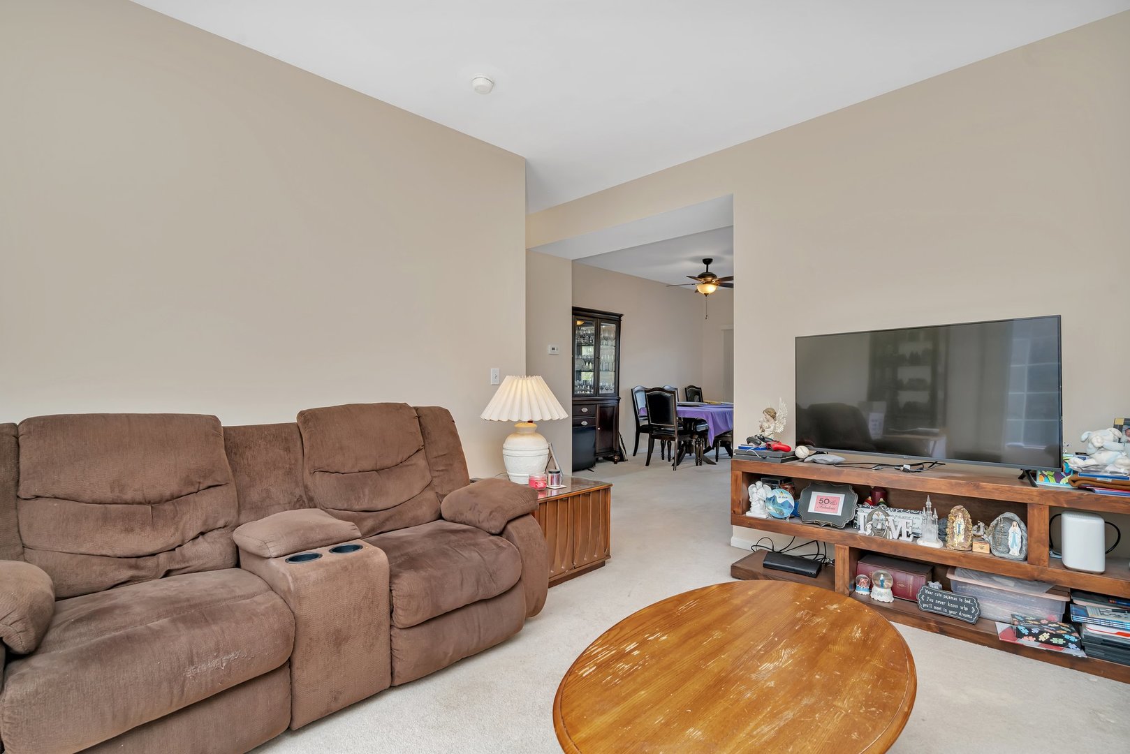 122 Enclave Circle, Unit D Bolingbrook, IL 60440 - Photo 4 of 20 a living room with furniture and a flat screen tv