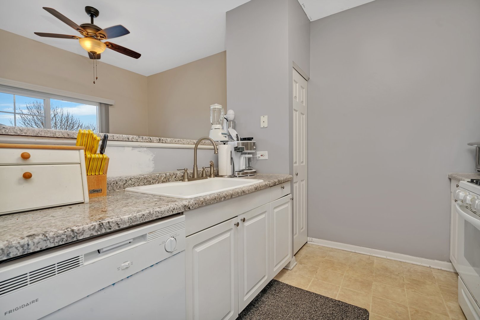 122 Enclave Circle, Unit D Bolingbrook, IL 60440 - Photo 7 of 20 a bathroom with a granite countertop sink and a mirror