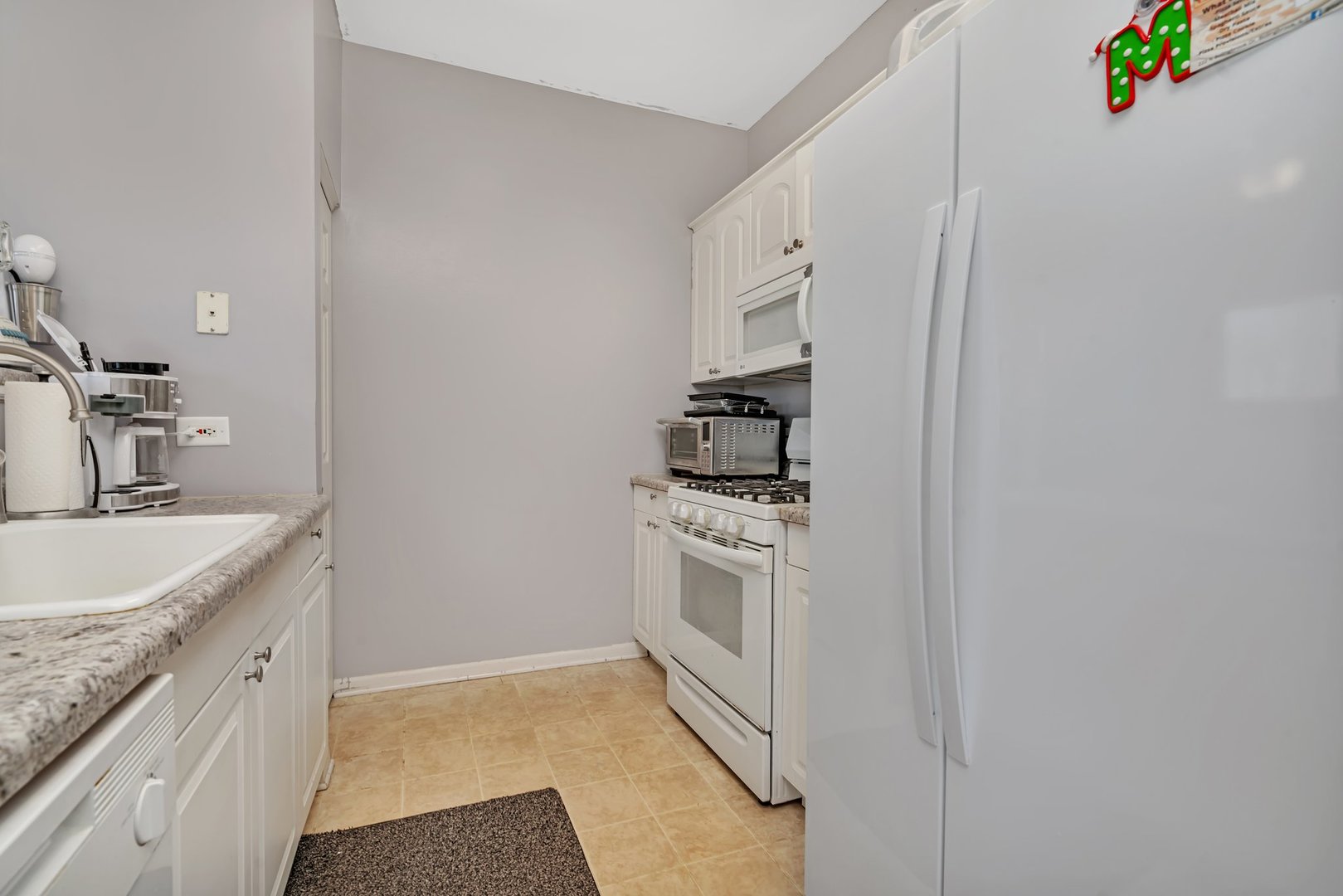 122 Enclave Circle, Unit D Bolingbrook, IL 60440 - Photo 8 of 20 a bathroom with a sink and a mirror