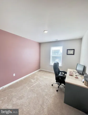 a workspace with furniture and window