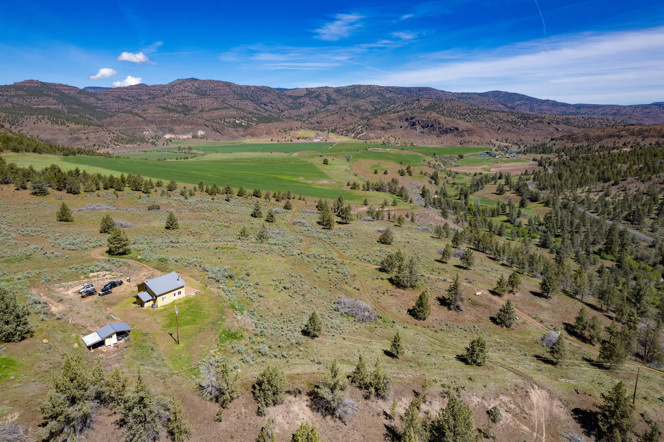40252 Rudio Road Kimberly, OR 97848 - Photo 14 of 34 a view of a lush green hillside and houses